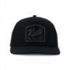 KIOTI Blackout Snapback from front on a white background.