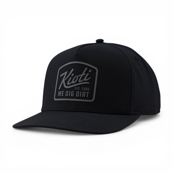 Slightly angled front view of KIOTI Blackout Snapback