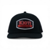 Front view of black Kioti Tractor cap featuring embroidered logo patch on structured crown